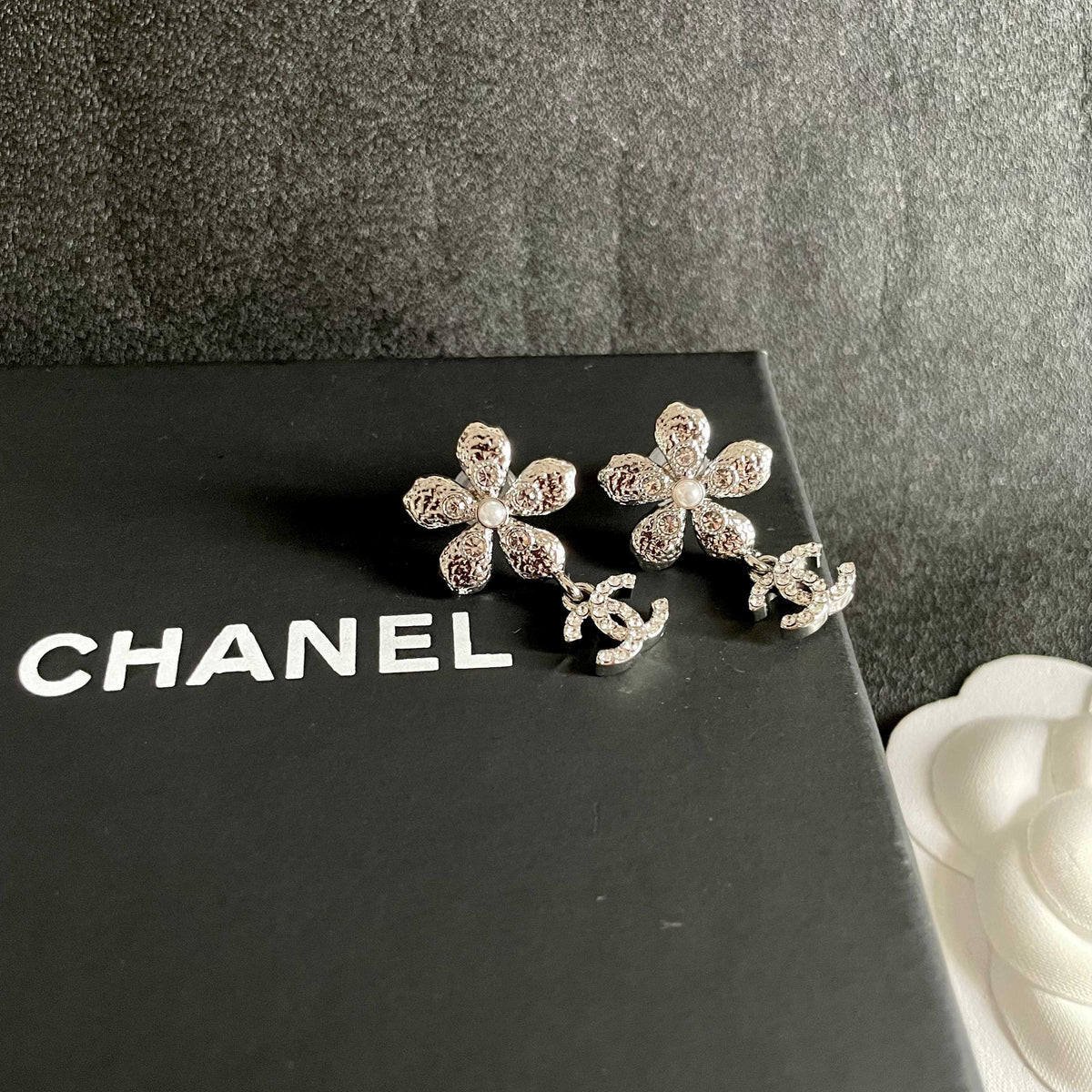 Martin Graham stud earrings in polished metal-tone – detail view