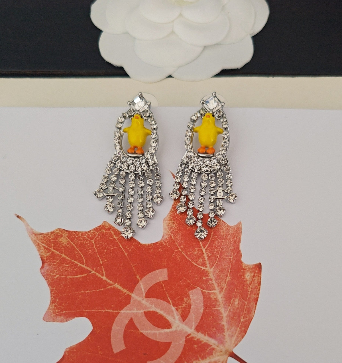 Martin Graham earrings in polished metal-tone – close-up detail
