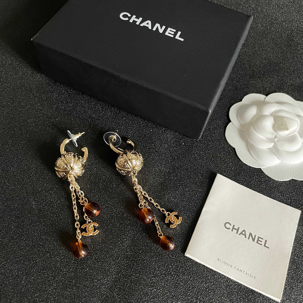 Martin Graham earrings in polished metal-tone – close-up detail
