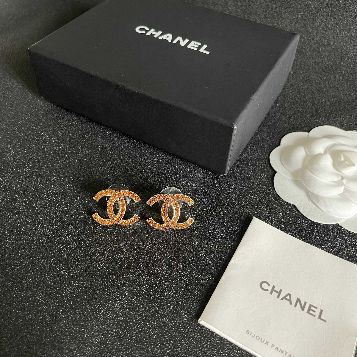 Martin Graham stud earrings in polished metal-tone – close-up detail