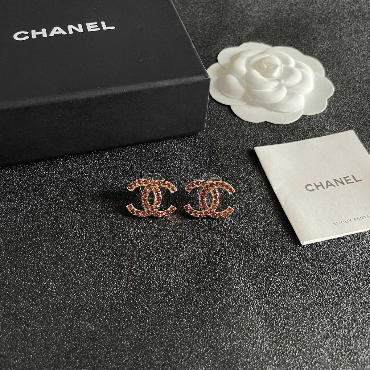 Martin Graham stud earrings in polished metal-tone – styled product view