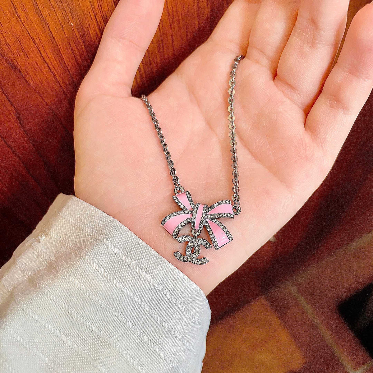 Martin Graham pendant necklace in polished metal-tone – side detail