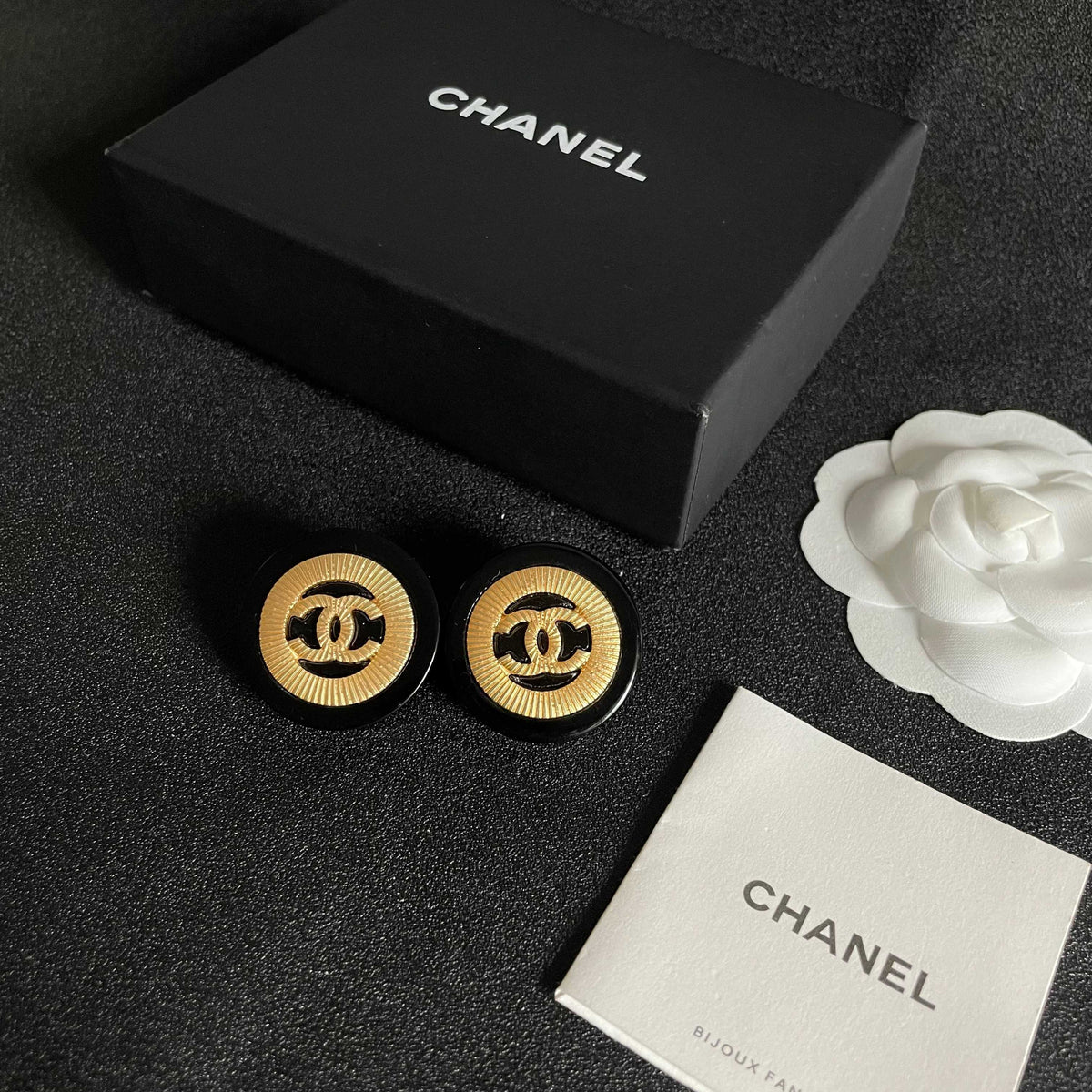 Martin Graham stud earrings in polished metal-tone – close-up detail