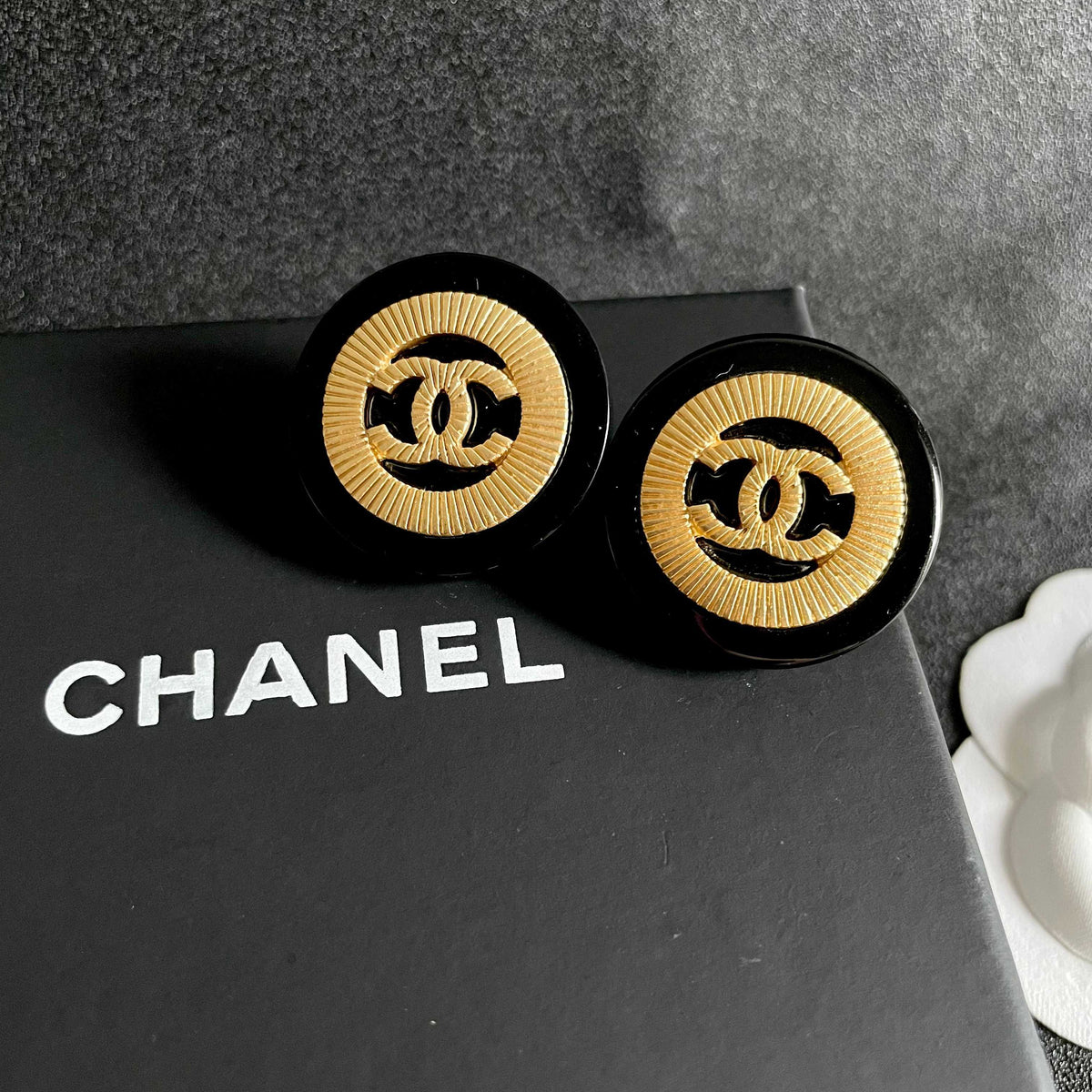 Martin Graham stud earrings in polished metal-tone – detail view
