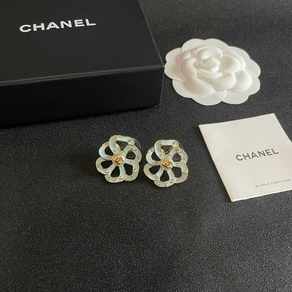 Martin Graham stud earrings in polished metal-tone – styled product view