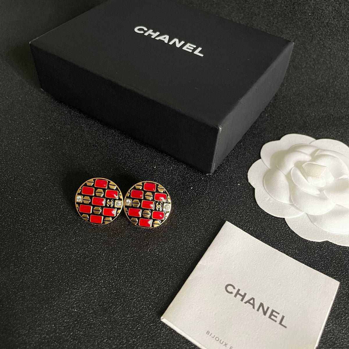 Martin Graham stud earrings in polished metal-tone – close-up detail