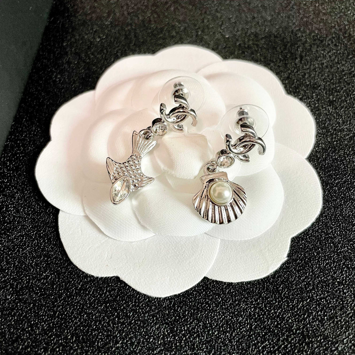 Martin Graham earrings in polished metal-tone – front product view