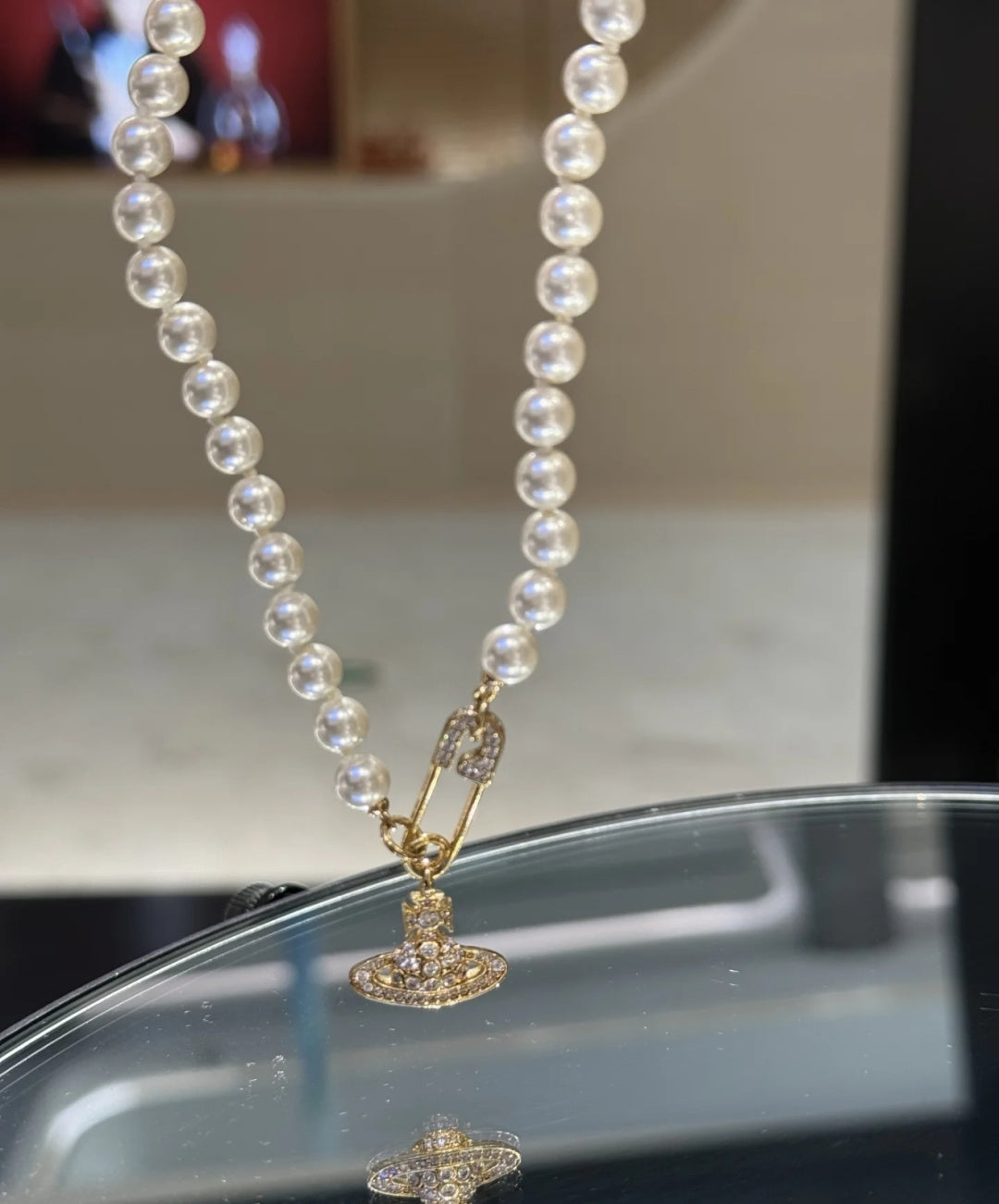 Martin Graham pendant necklace in polished metal-tone – close-up detail