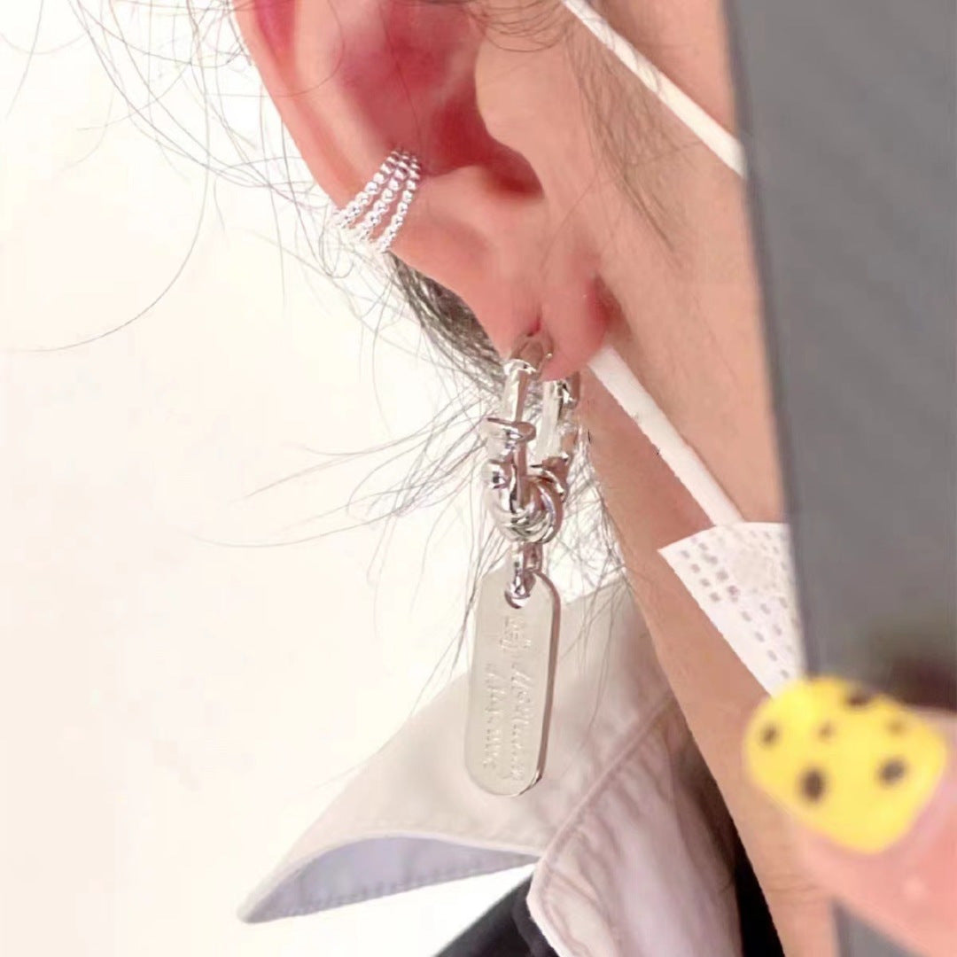Martin Graham earrings in polished metal-tone – front product view