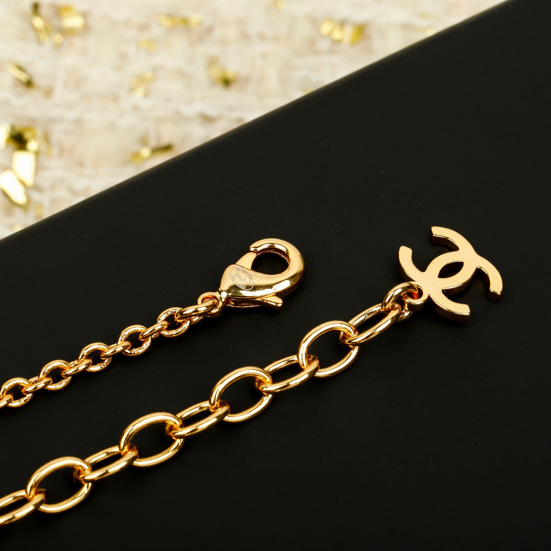 Martin Graham pendant necklace in polished metal-tone – close-up detail