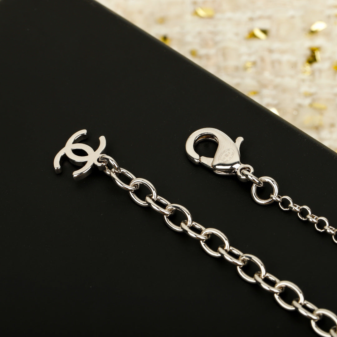 Martin Graham pendant necklace in polished metal-tone – close-up detail