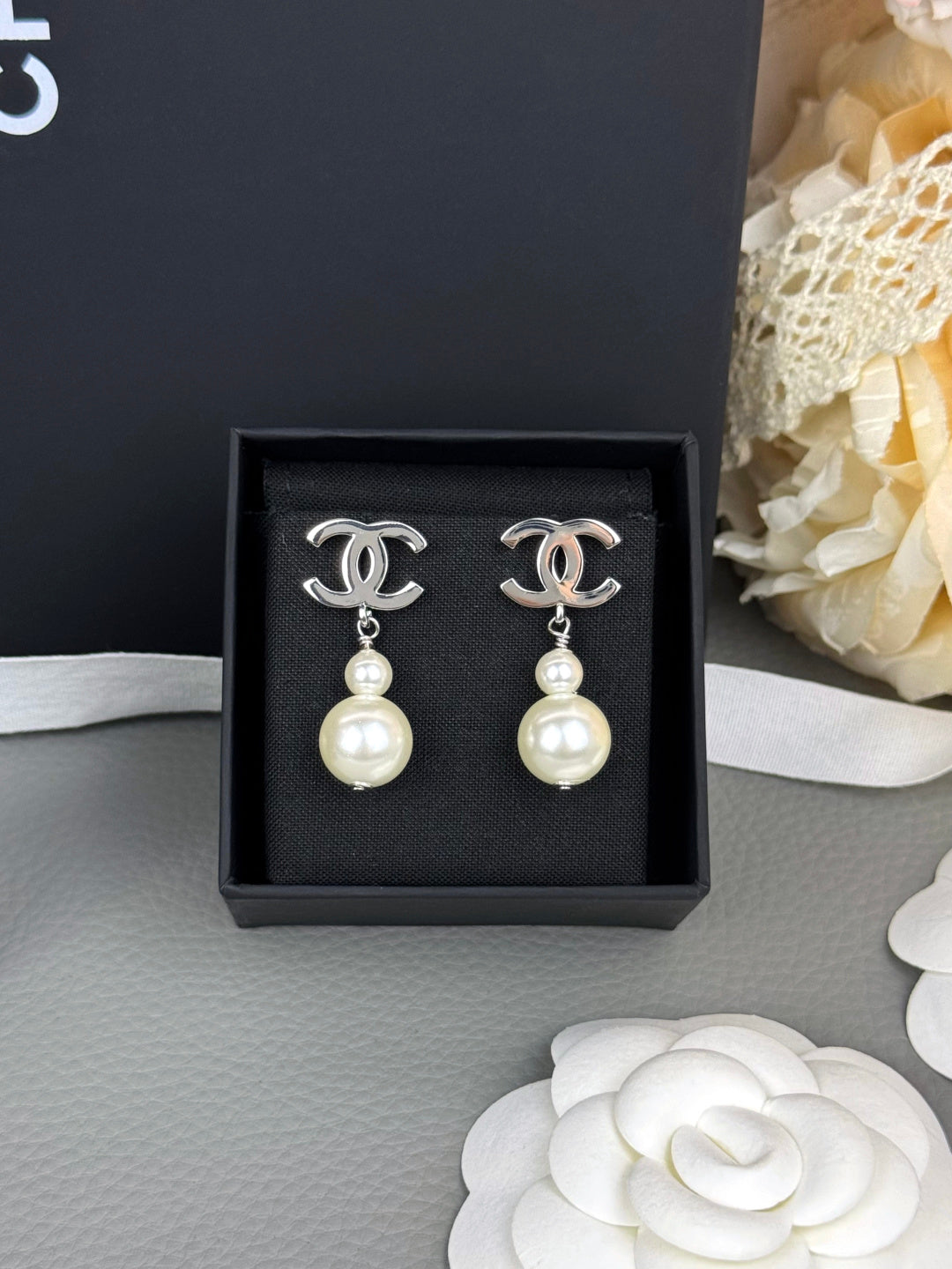 Martin Graham earrings in polished metal-tone – front product view