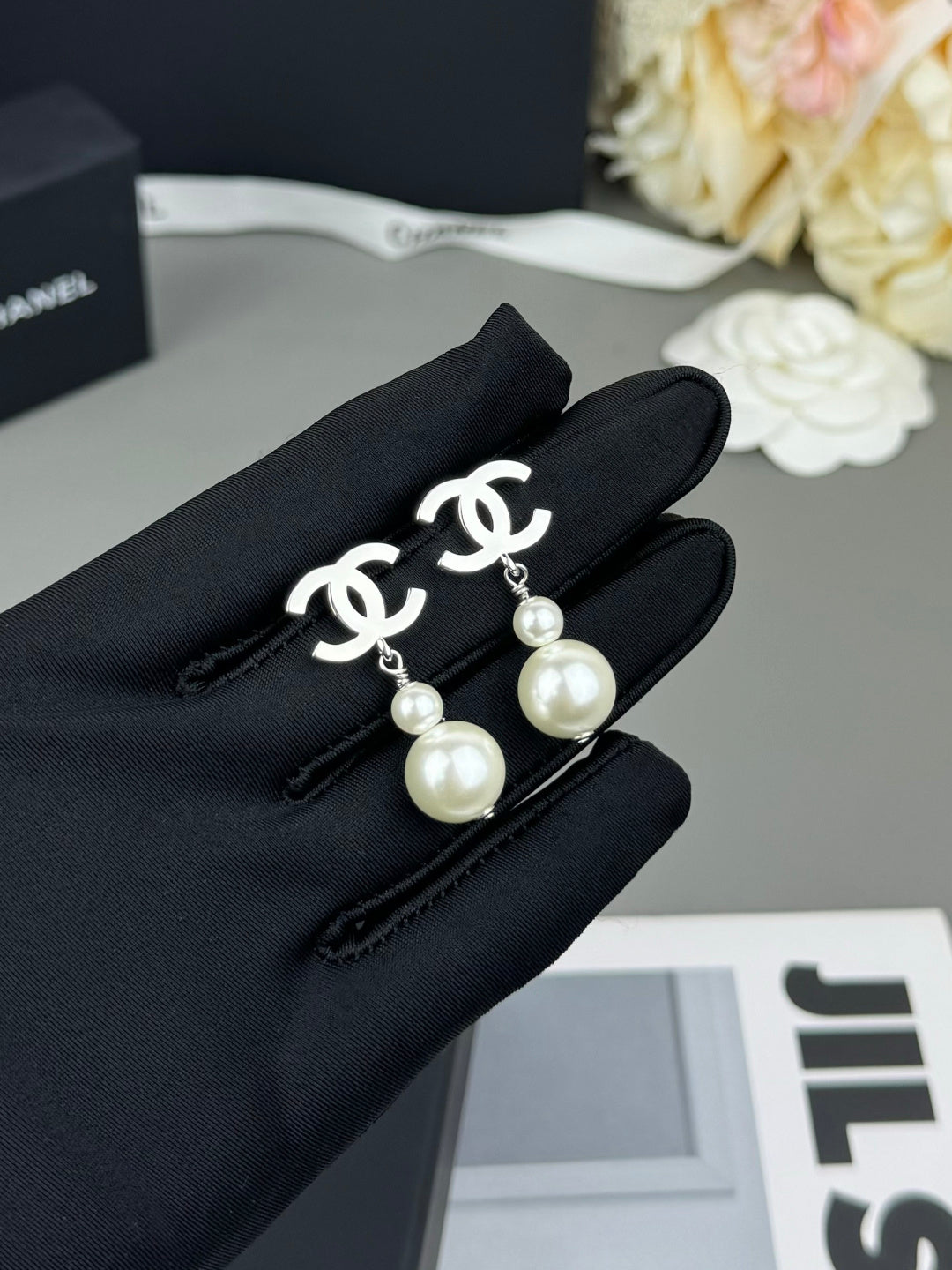 Martin Graham earrings in polished metal-tone – close-up detail