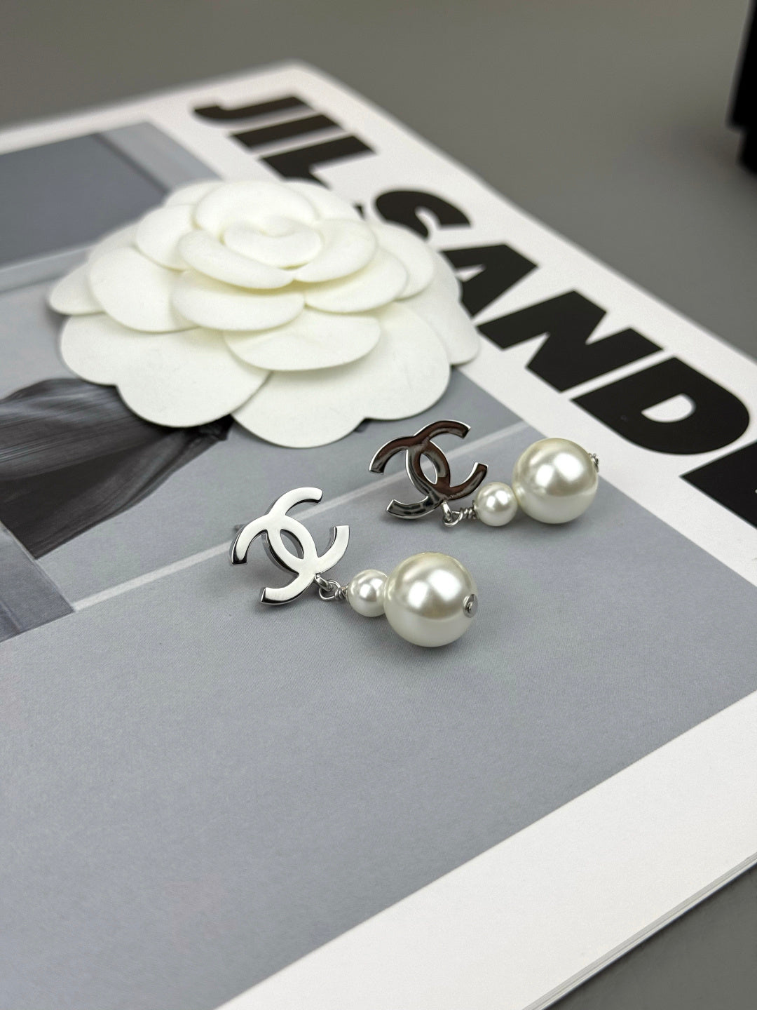 Martin Graham earrings in polished metal-tone – front product view