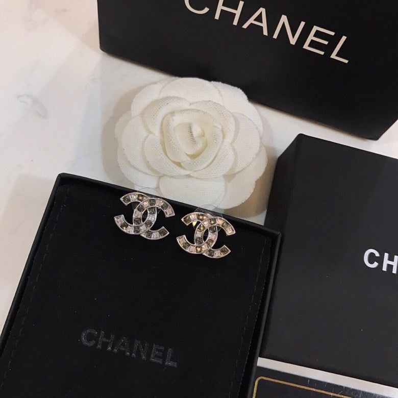 Martin Graham stud earrings in polished metal-tone – styled product view