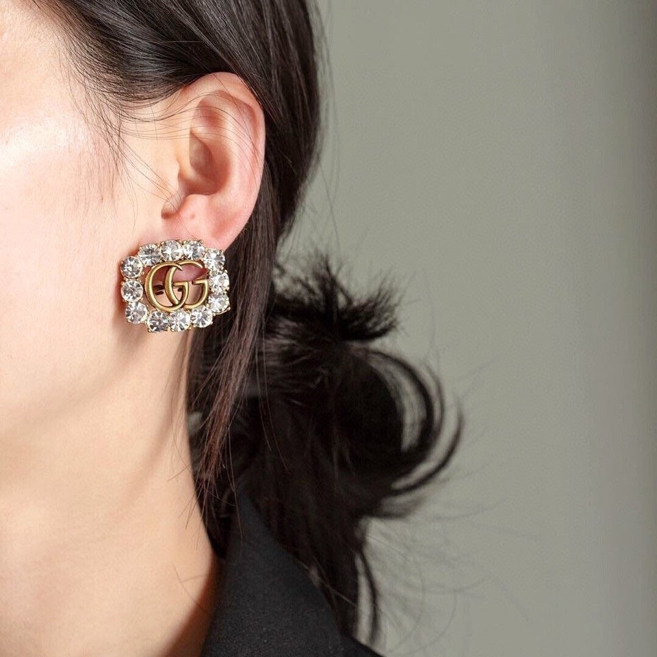Martin Graham stud earrings in polished metal-tone – detail view
