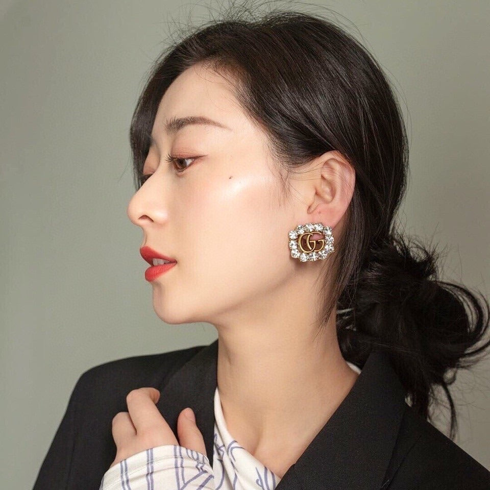 Martin Graham stud earrings in polished metal-tone – front product view