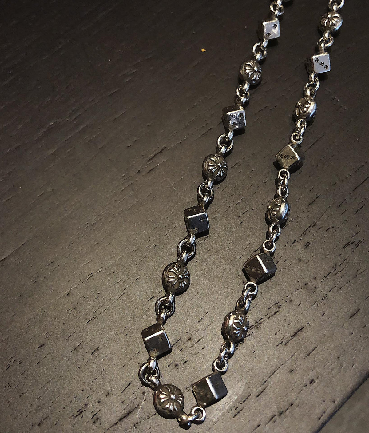 Martin Graham pendant necklace in polished metal-tone – close-up detail