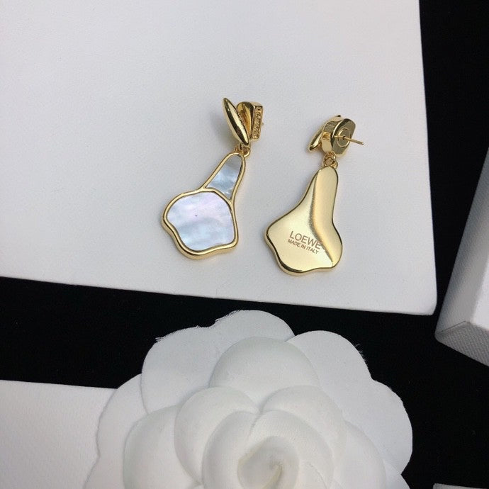 Martin Graham stud earrings in polished metal-tone – side detail