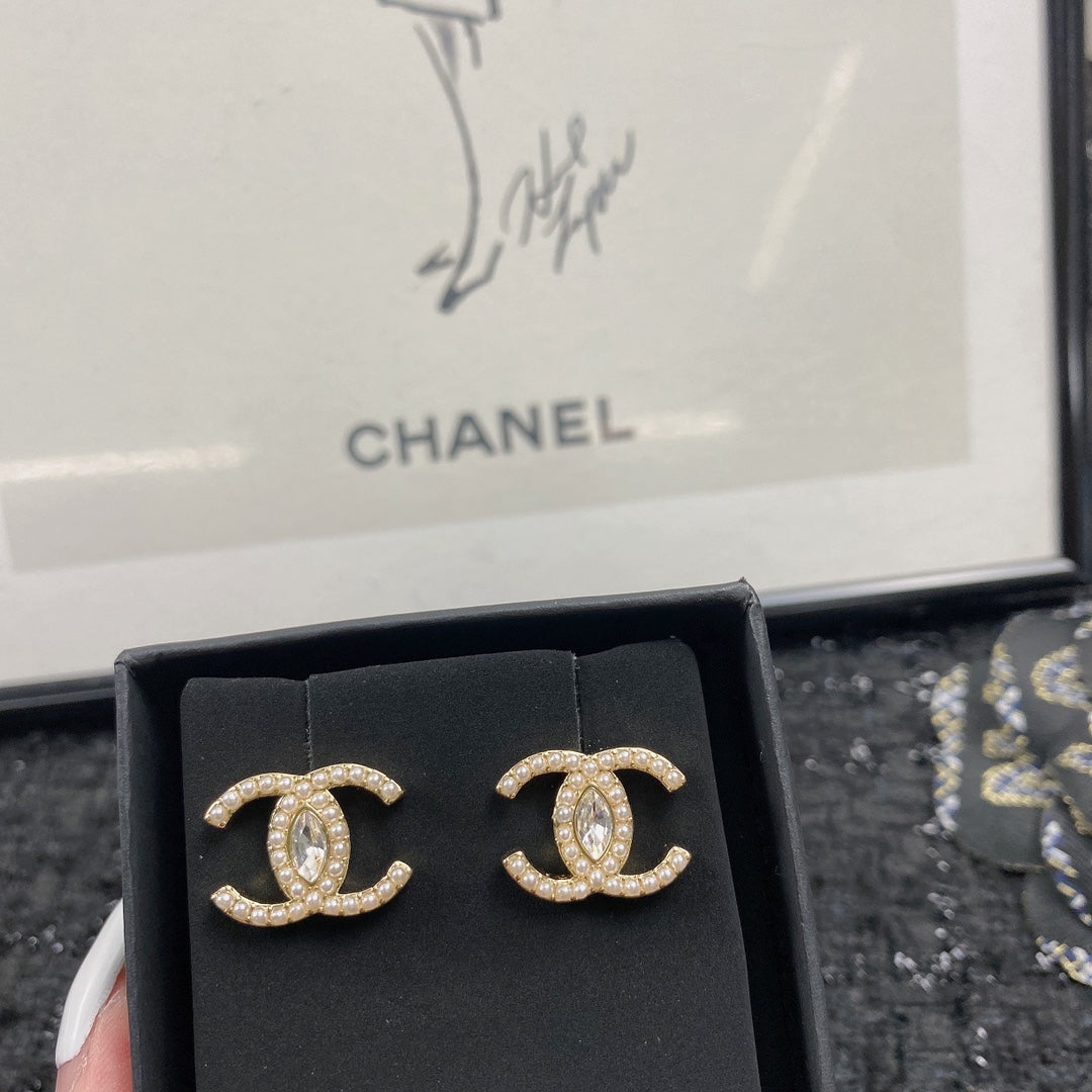 Martin Graham stud earrings in polished metal-tone – styled product view