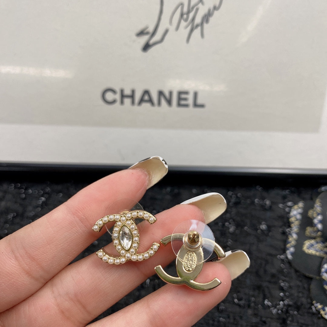 Martin Graham stud earrings in polished metal-tone – close-up detail