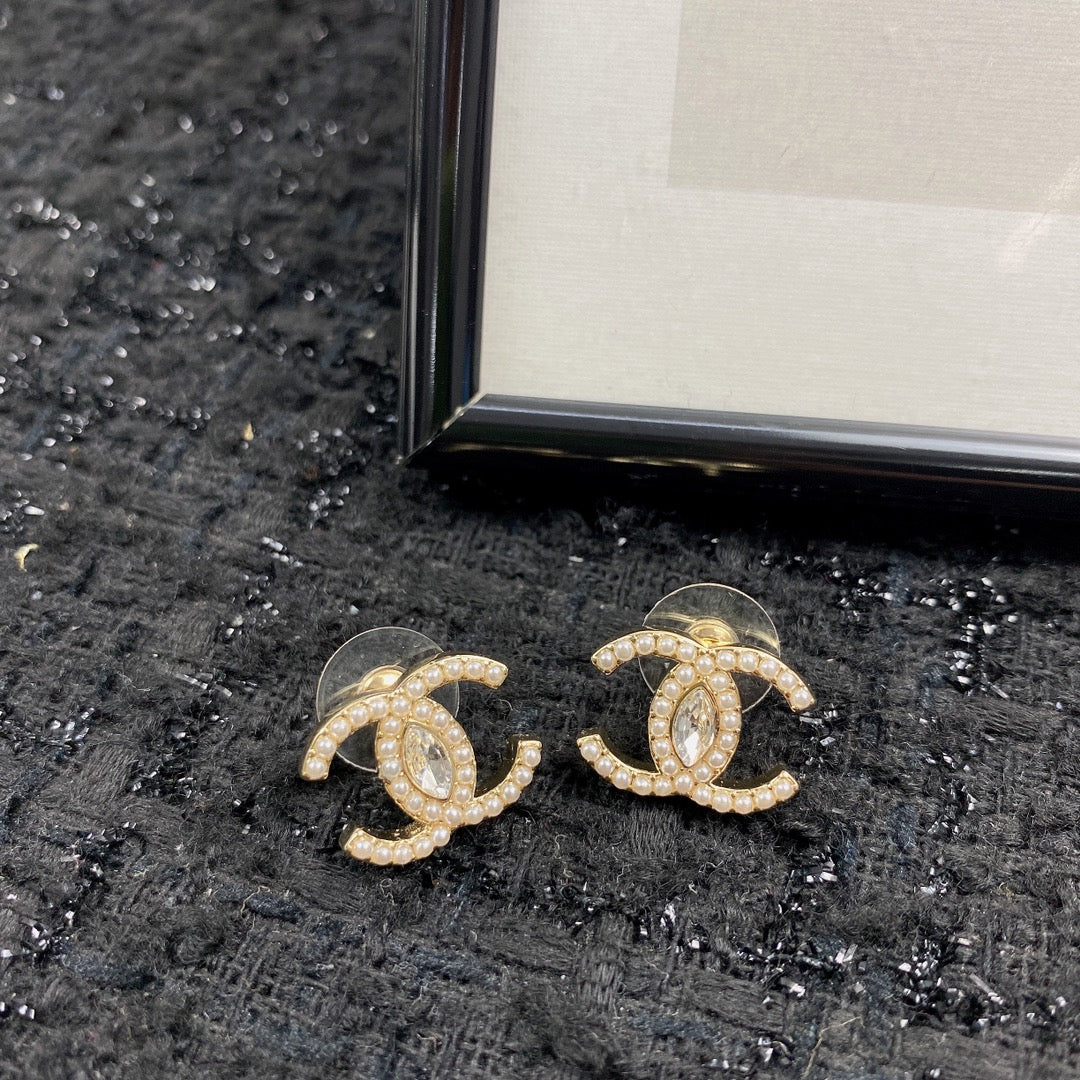 Martin Graham stud earrings in polished metal-tone – front product view