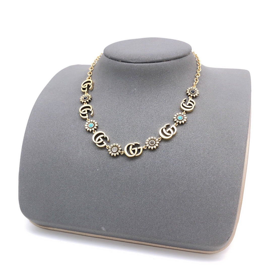Martin Graham pendant necklace in polished metal-tone – close-up detail