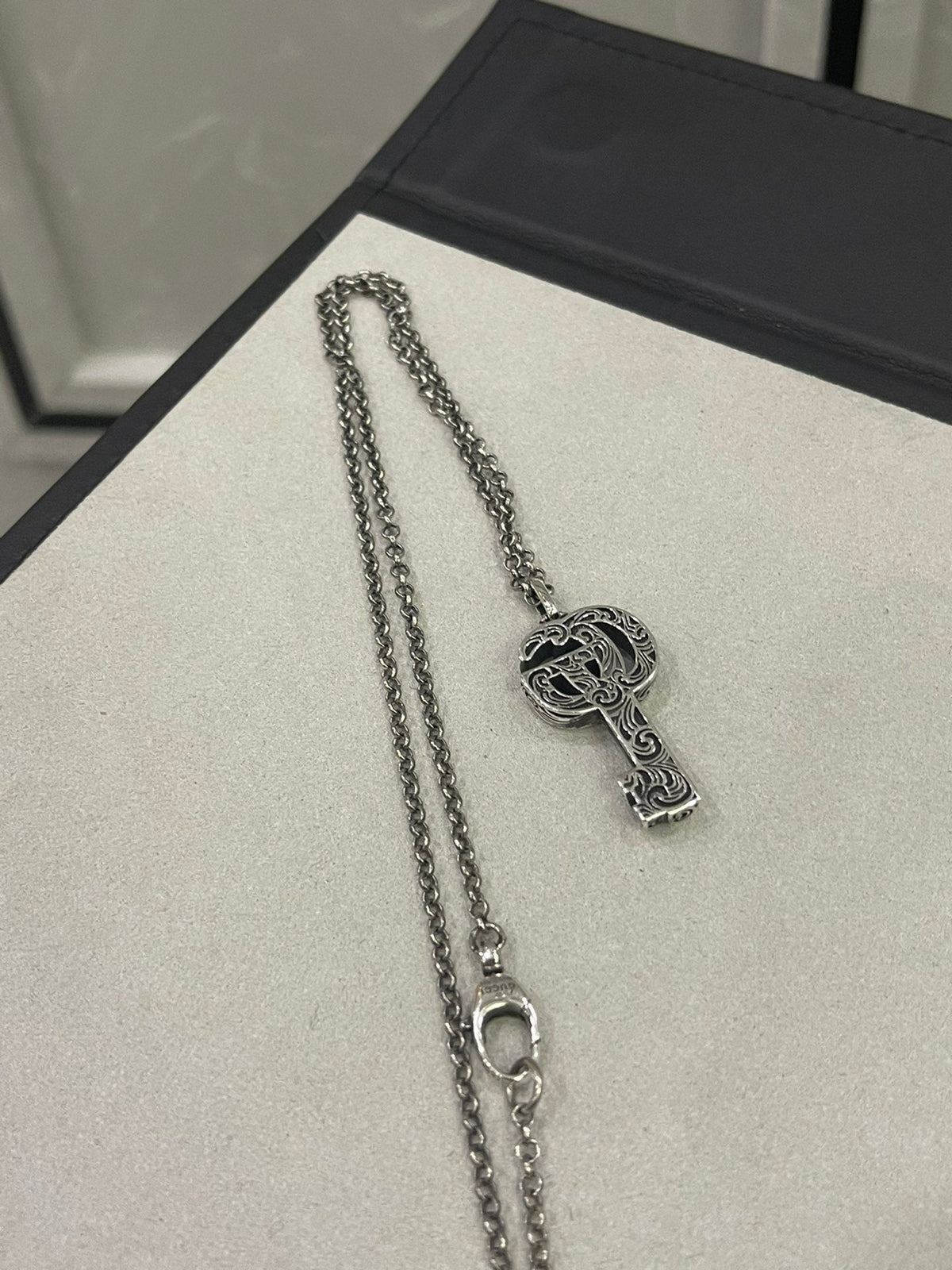 Martin Graham jewelry accessory in polished metal-tone – close-up detail