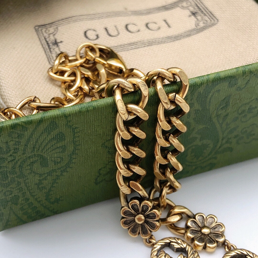 Martin Graham pendant necklace in polished metal-tone – close-up detail