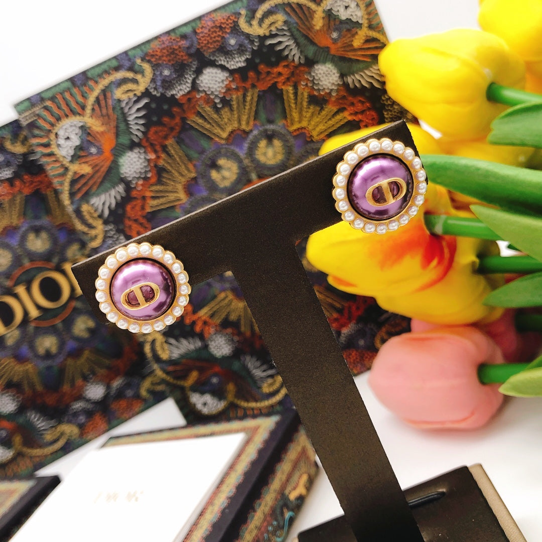 Martin Graham stud earrings in polished metal-tone