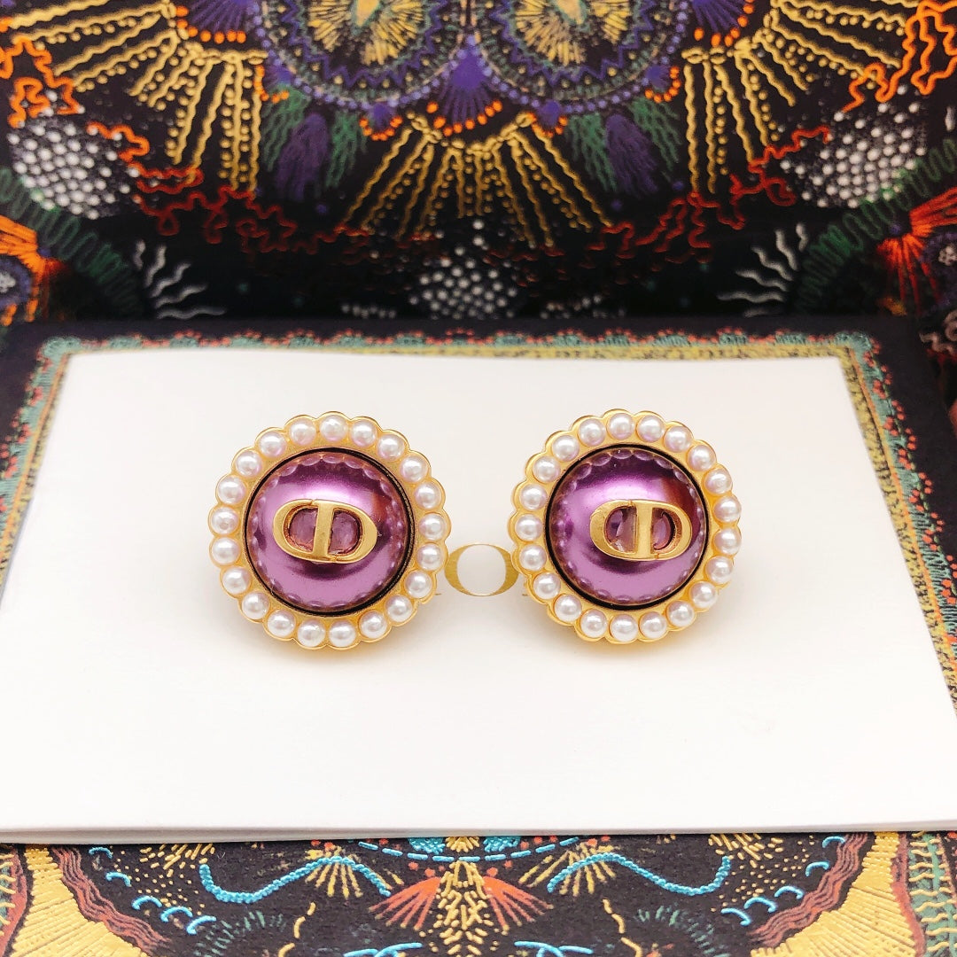 Martin Graham stud earrings in polished metal-tone – close-up detail