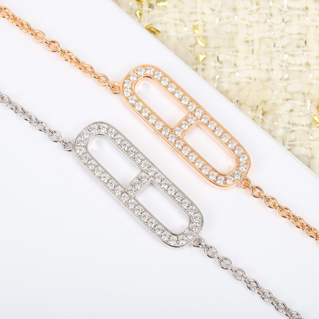 Martin Graham pendant necklace in polished metal-tone – close-up detail