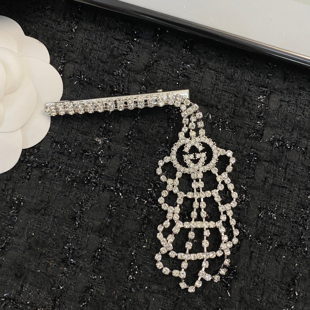 Martin Graham hair accessory in polished metal-tone – close-up detail