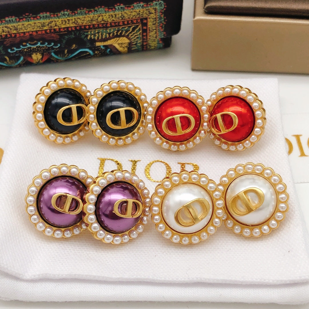 Martin Graham stud earrings in polished metal-tone – detail view