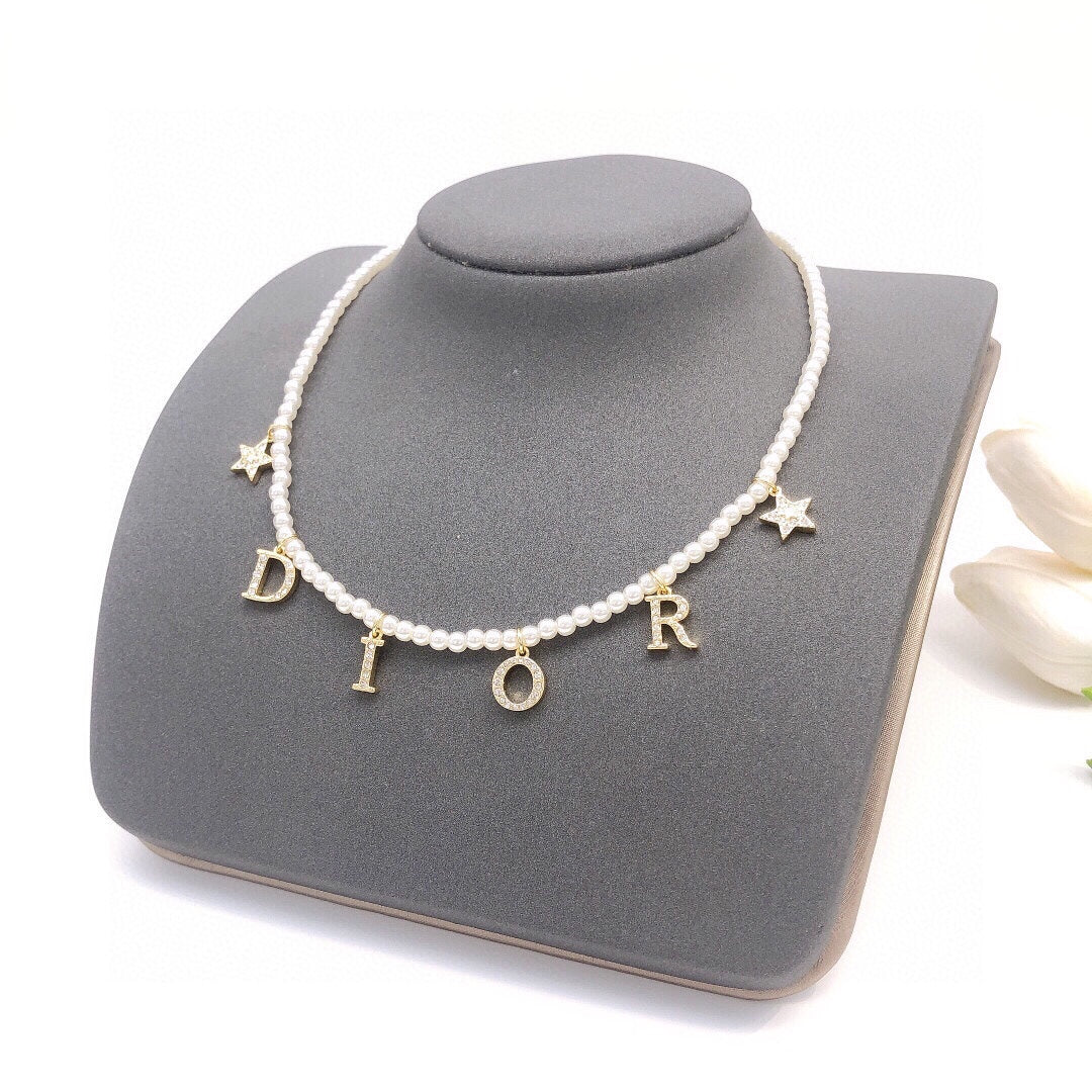 Martin Graham pendant necklace in polished metal-tone – front view