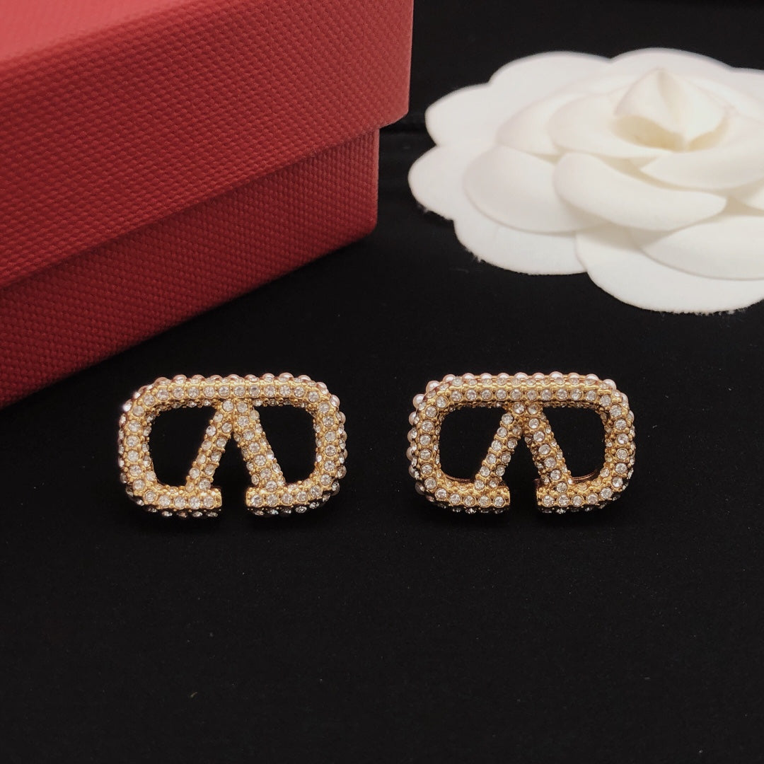 Martin Graham stud earrings in polished metal-tone – detail view