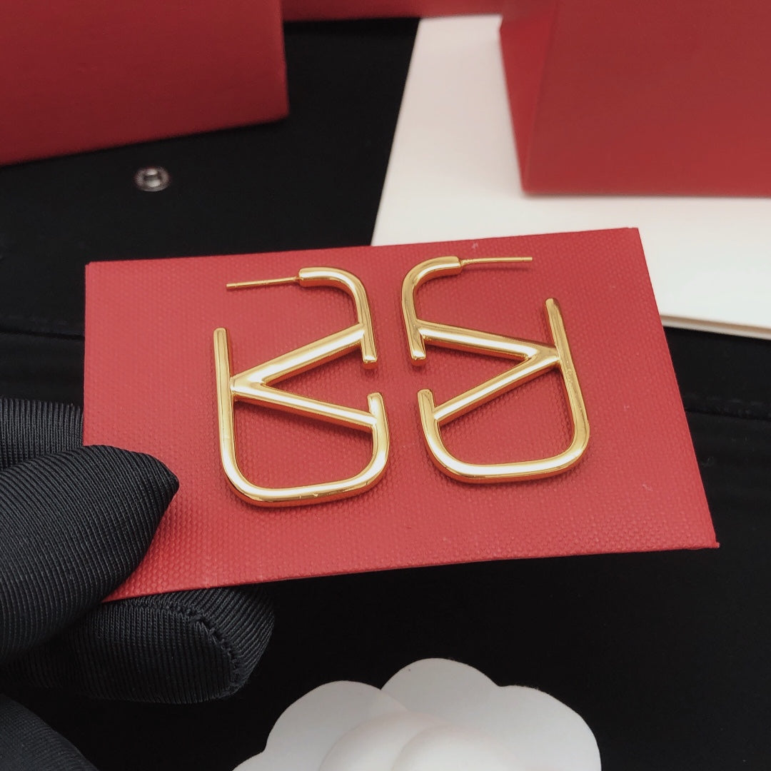 Martin Graham stud earrings in polished metal-tone – side detail
