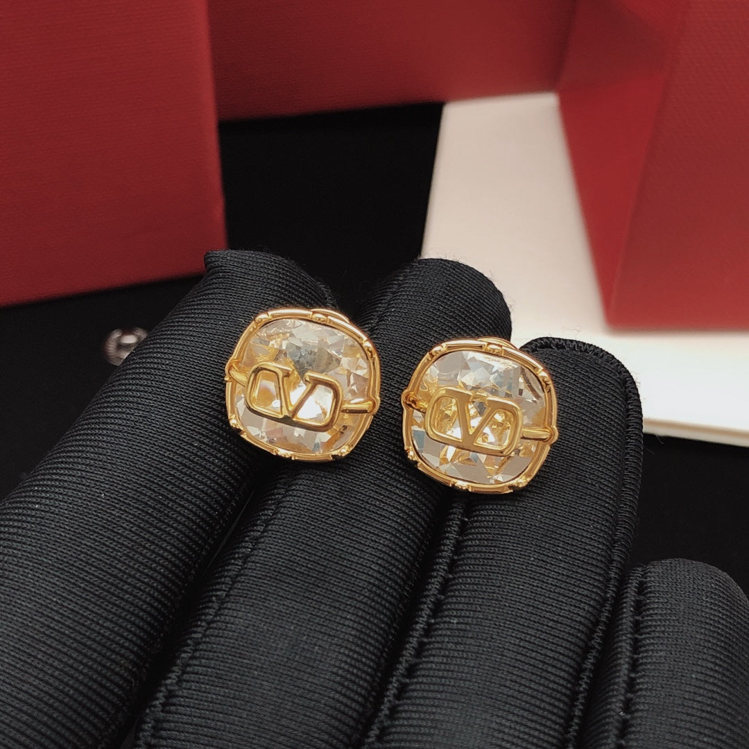Martin Graham stud earrings in polished metal-tone