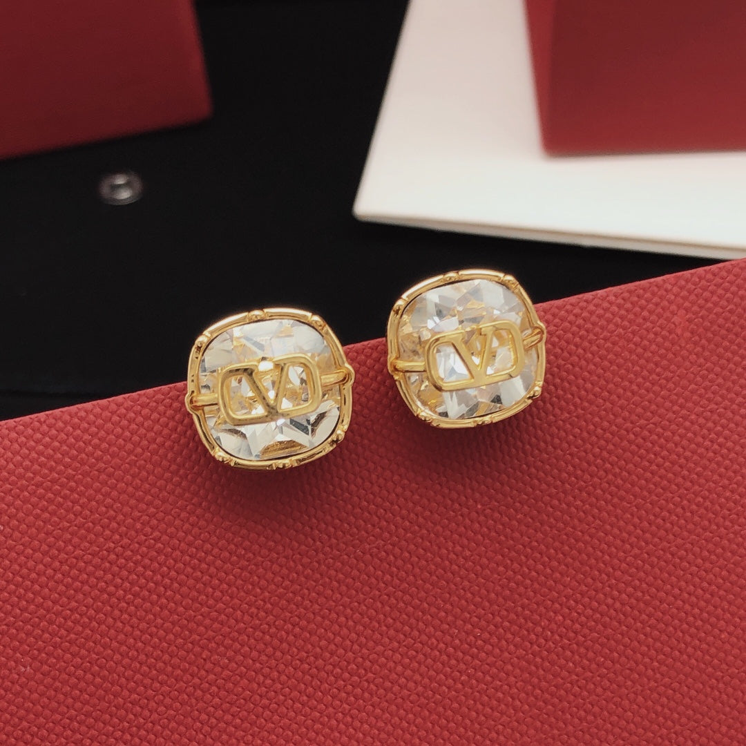 Martin Graham stud earrings in polished metal-tone – side detail