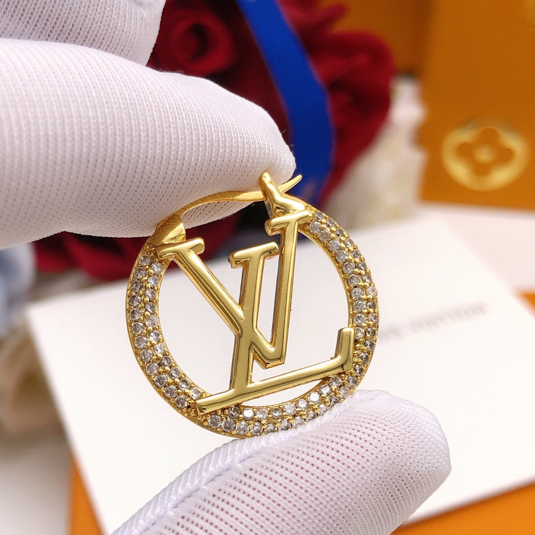 Martin Graham earrings in polished metal-tone – close-up detail