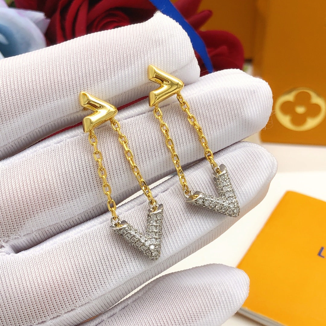 Martin Graham stud earrings in polished metal-tone – close-up detail
