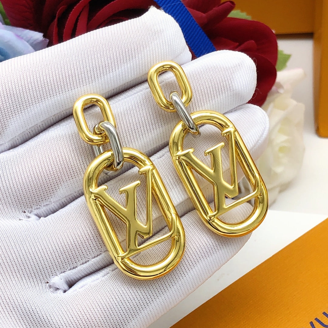 Martin Graham earrings in polished metal-tone – close-up detail