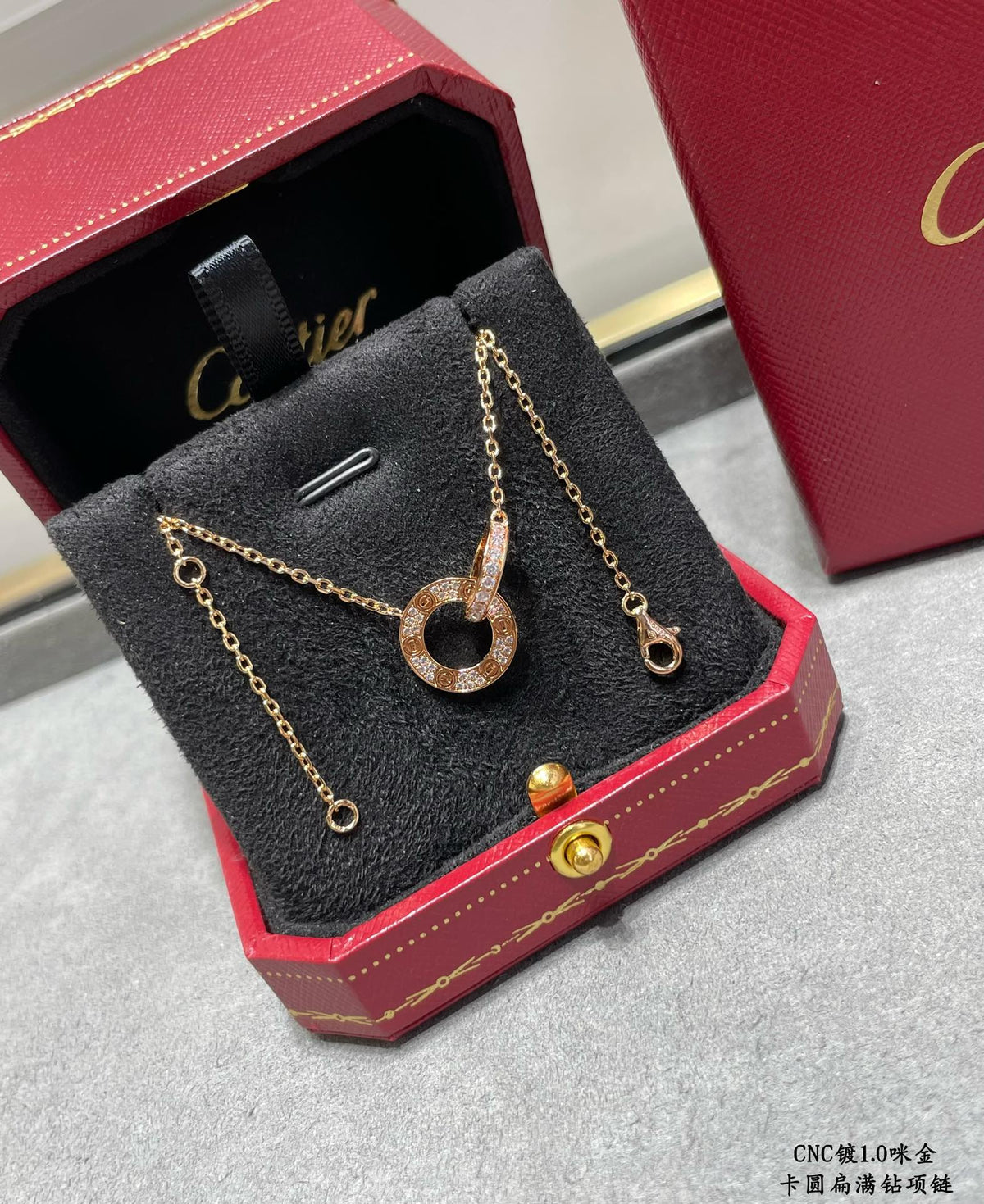 Martin Graham pendant necklace in polished metal-tone – front view