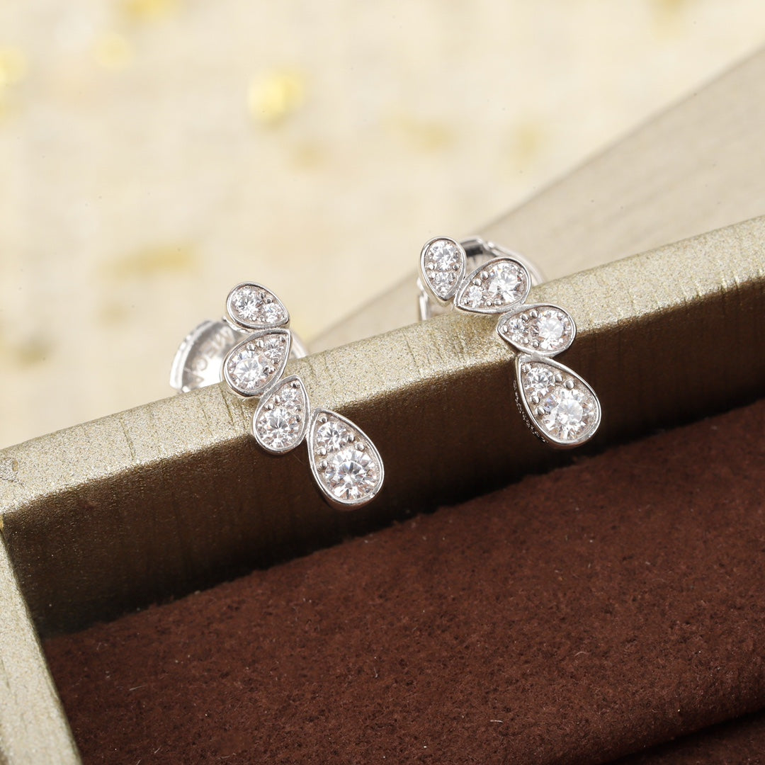 Martin Graham earrings in polished metal-tone – close-up detail