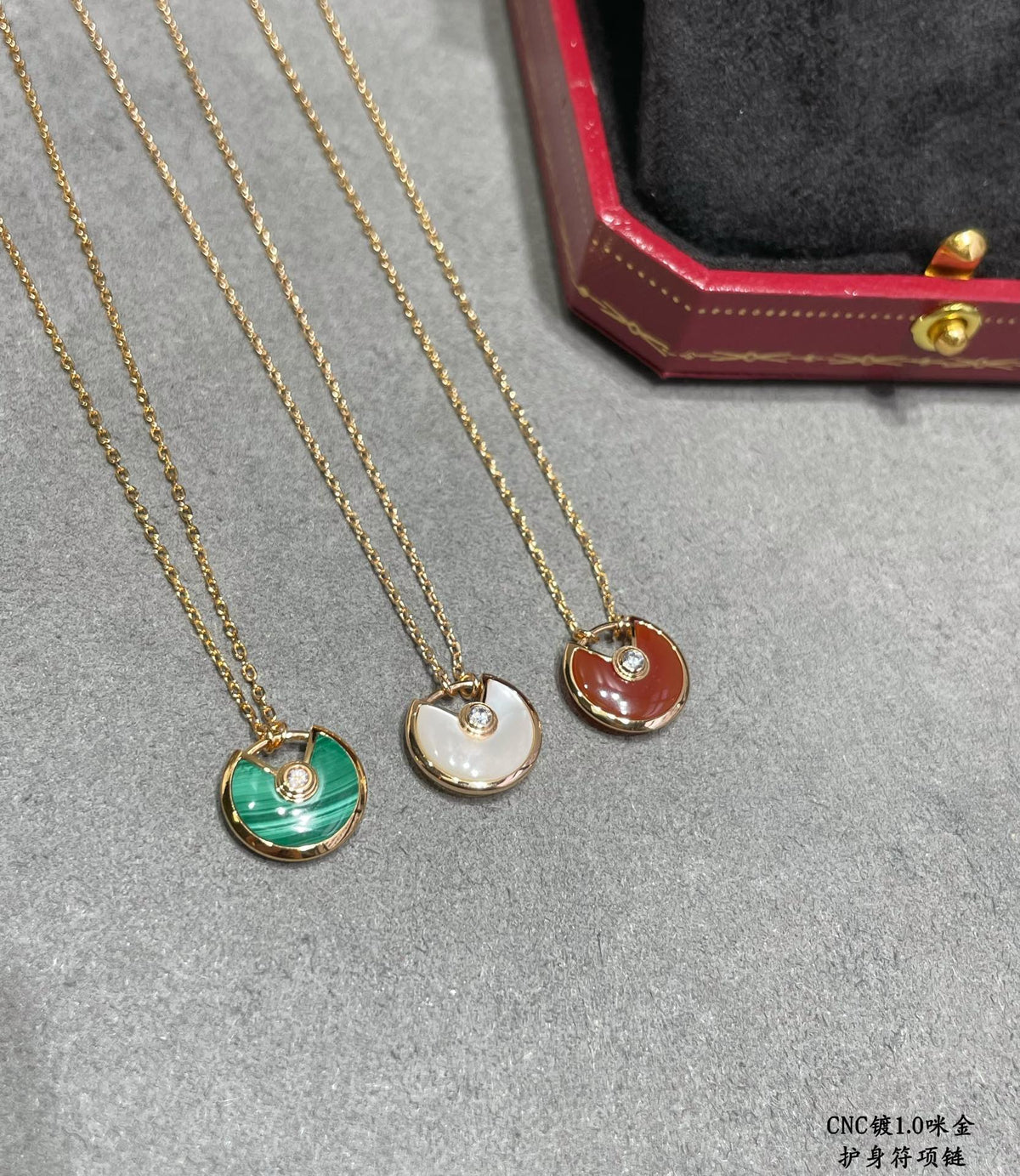 Martin Graham pendant necklace in polished metal-tone – front view