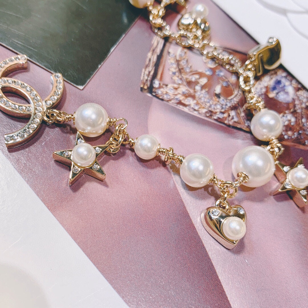 Martin Graham pendant necklace in polished metal-tone – close-up detail