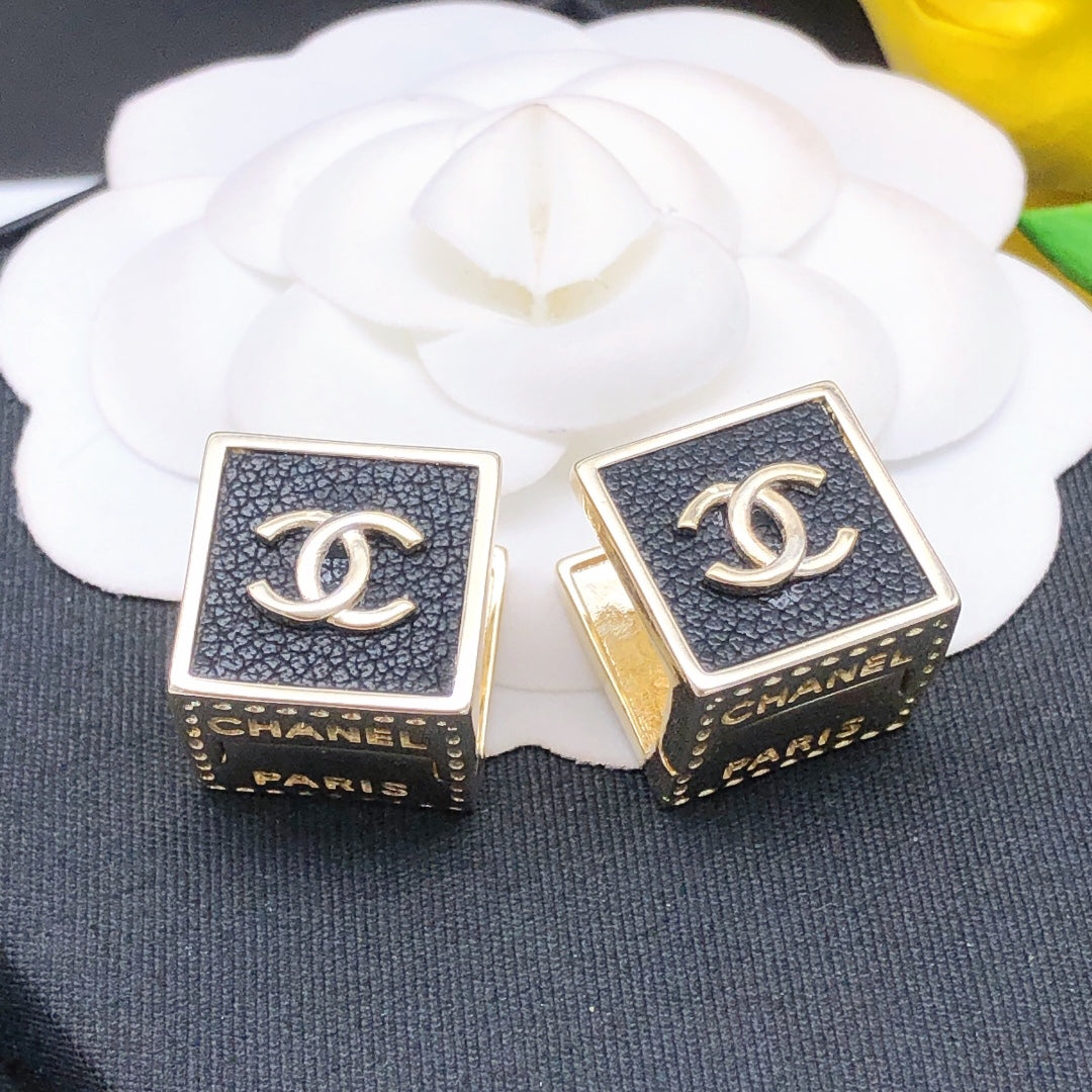 Martin Graham stud earrings in polished metal-tone – side detail