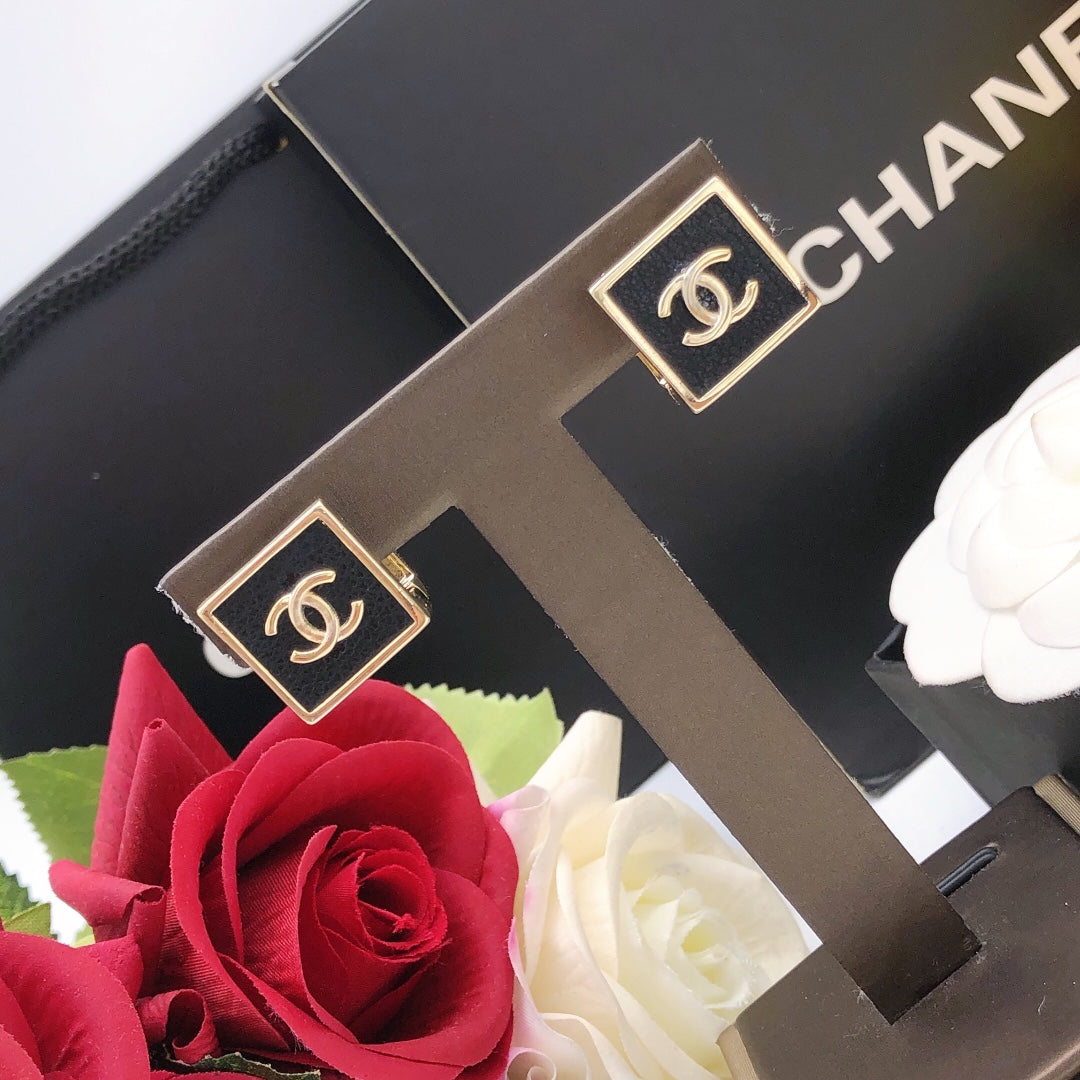 Martin Graham stud earrings in polished metal-tone – styled product view