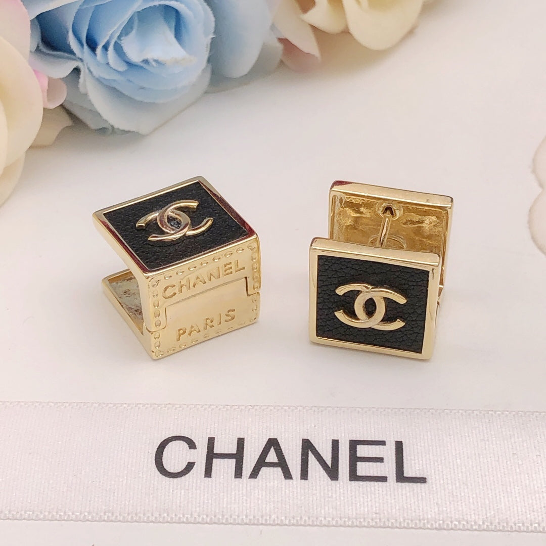 Martin Graham stud earrings in polished metal-tone – detail view