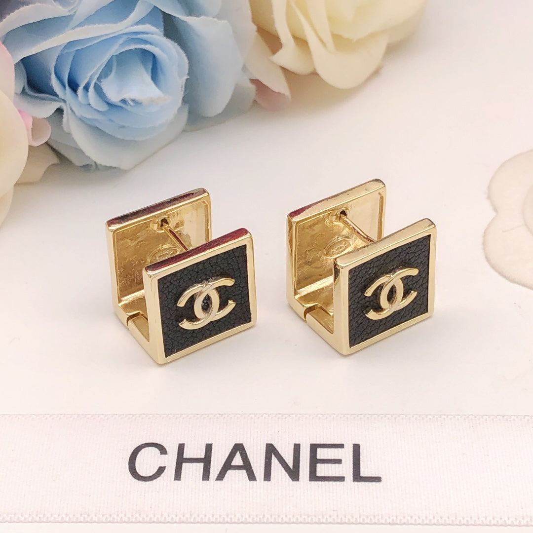 Martin Graham stud earrings in polished metal-tone – front product view